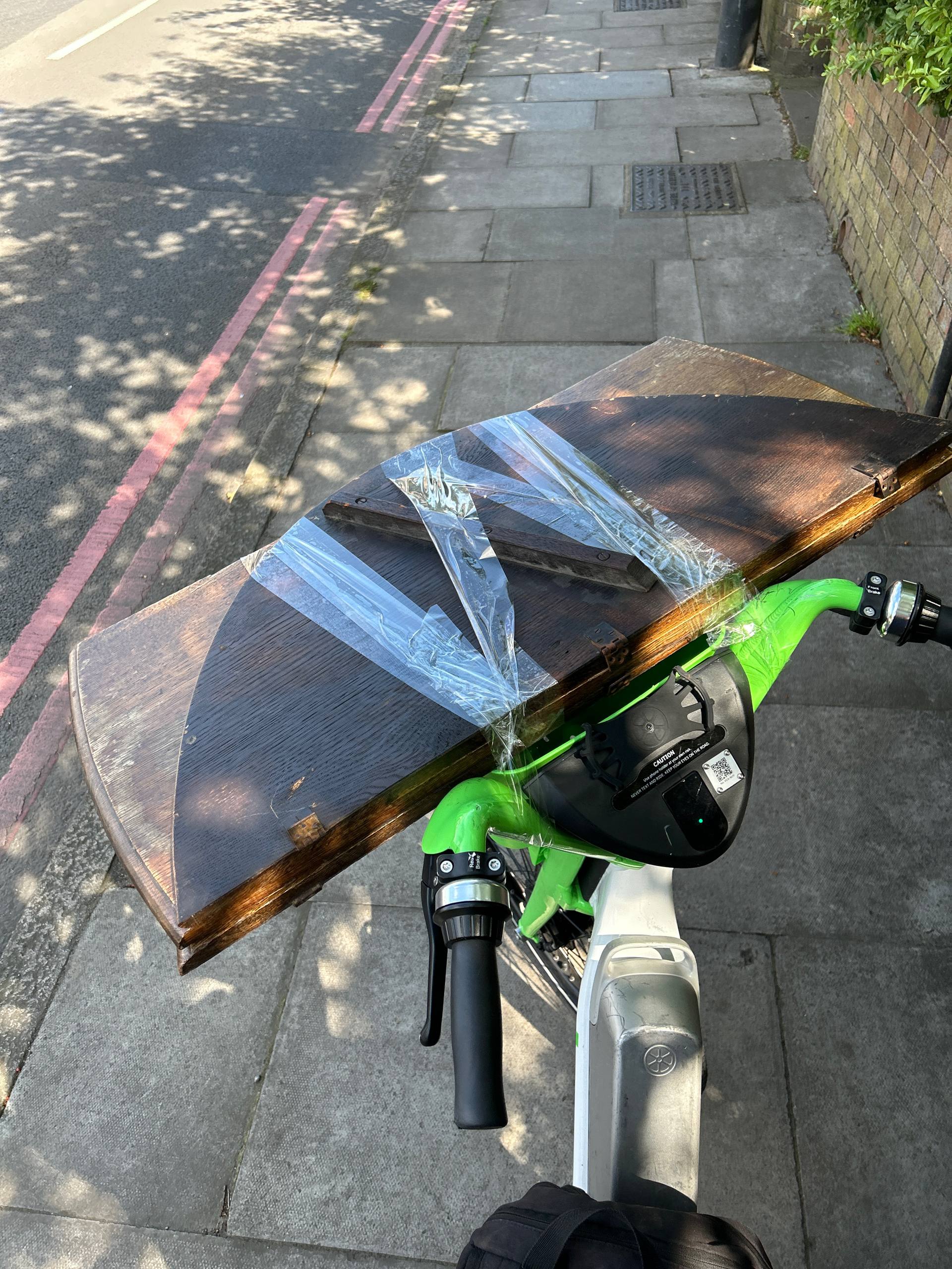 Furniture being transported on a bicycle with tape — a UK reseller's reality before discovering Shiply