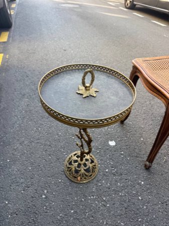 Round brass occasional table with a pierced gallery rim