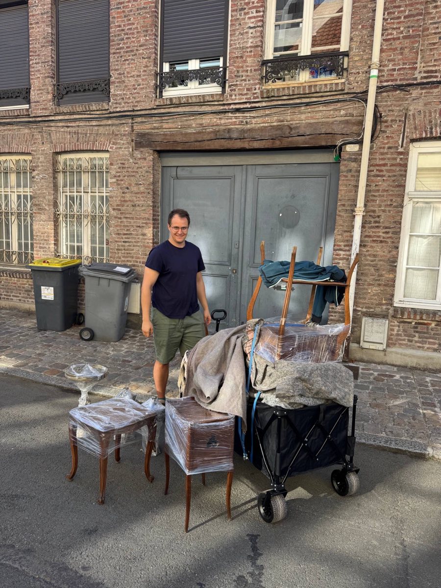 Folding market trolley loaded with cling-wrapped furniture at the Braderie de Lille flea market