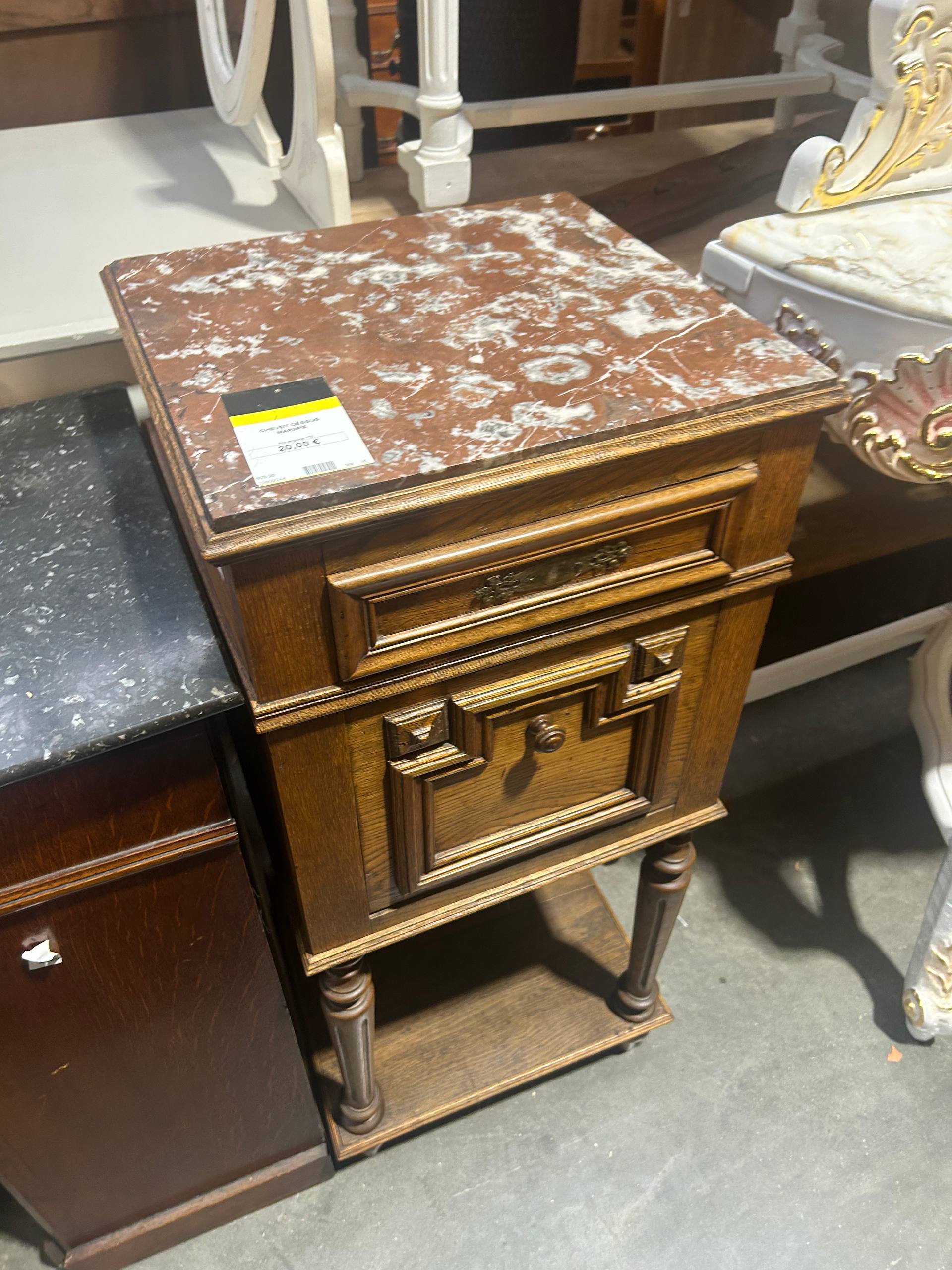 Marble-topped antique bedside table from a French market — the kind of stock Saint-Ouen Paul Bert Serpette specialises in