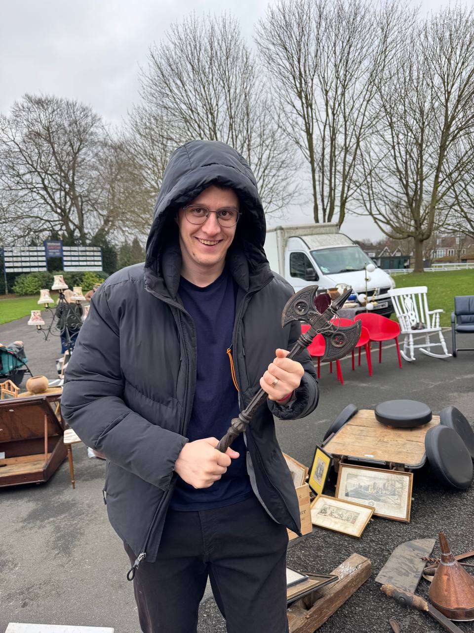 Oleksandr Prudnikov holding a vintage small axe found at a UK car boot sale
